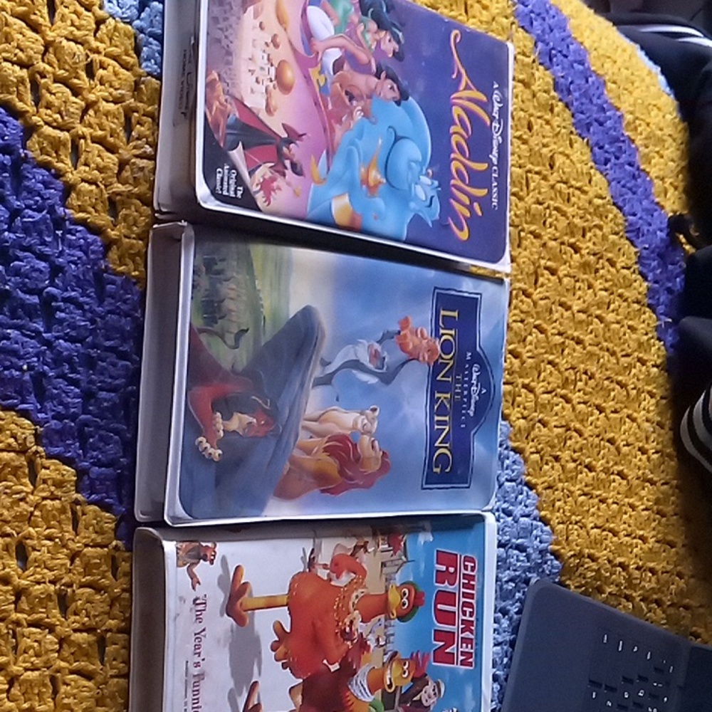 Chicken Run, Lion King, and Aladdin VHS Tapes